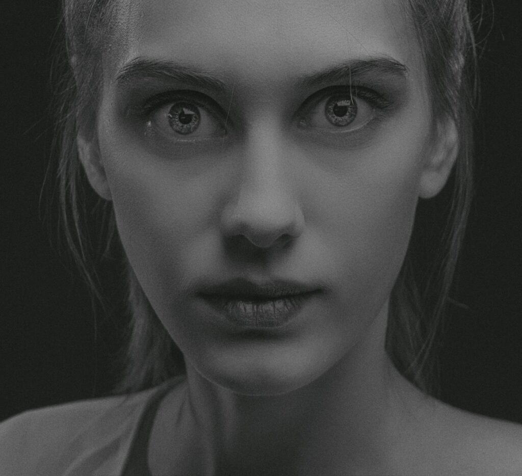 a black and white photo of a woman's face