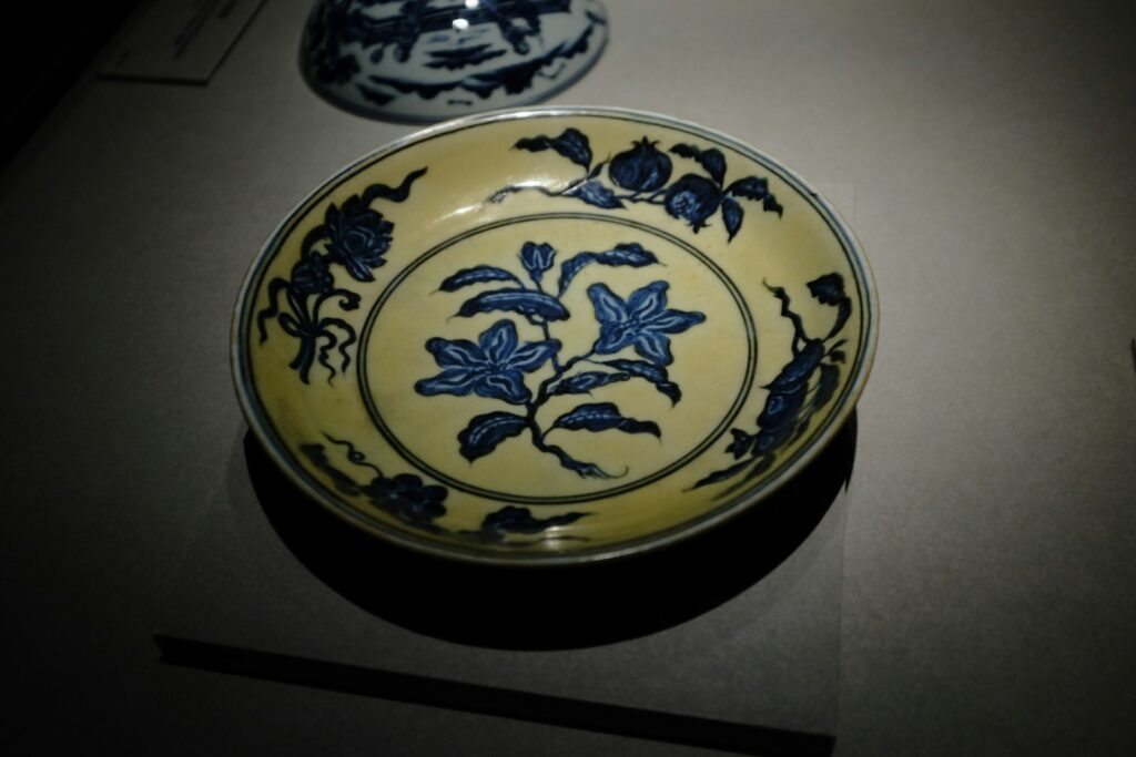 white and blue floral ceramic plate
