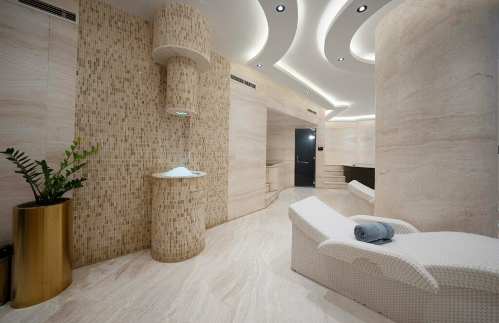 A bathroom with a tub, sink, and toilet in it