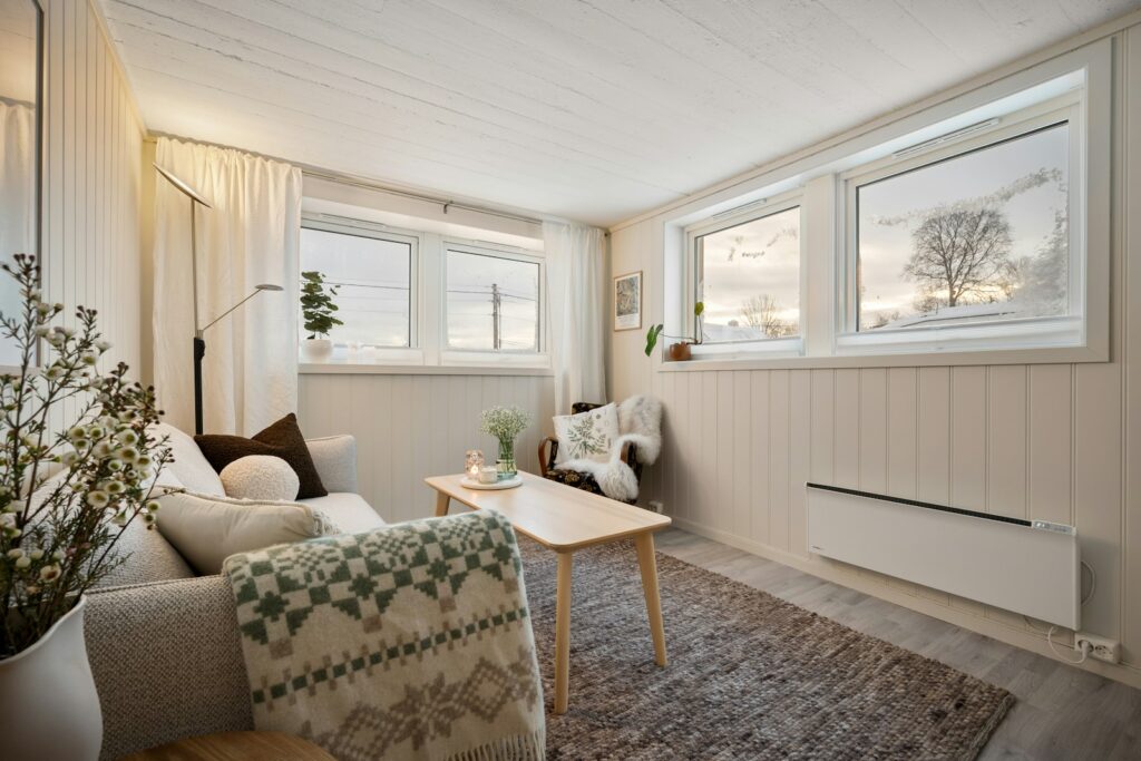 A living room filled with furniture and windows