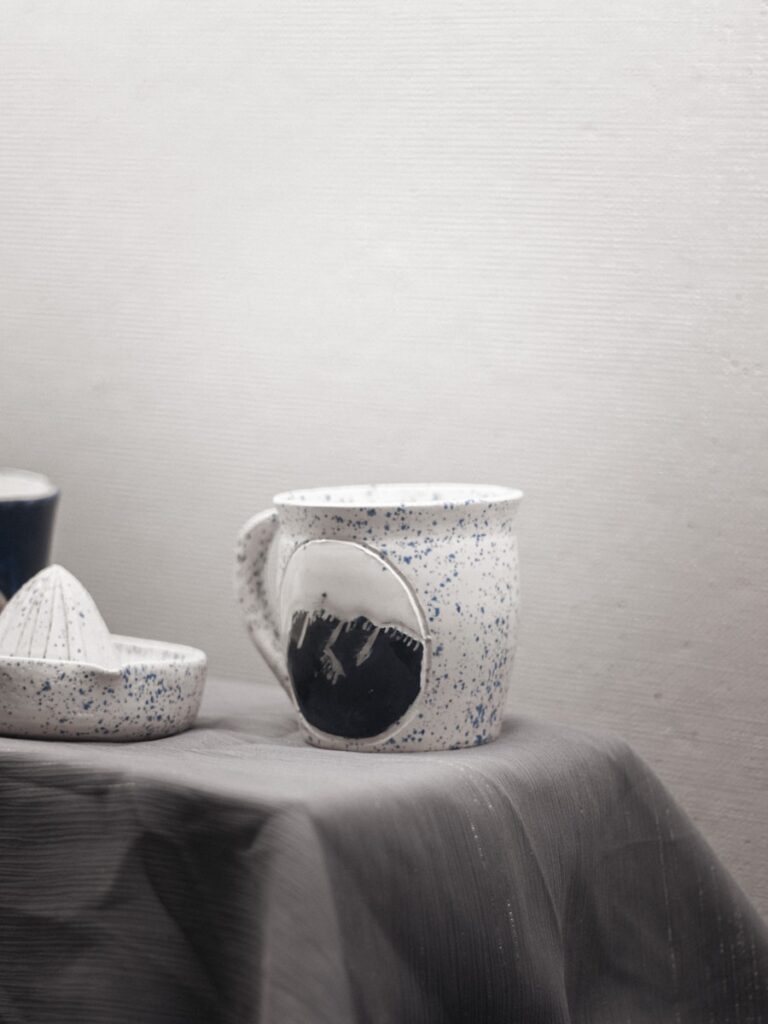 a couple of cups sitting on top of a table